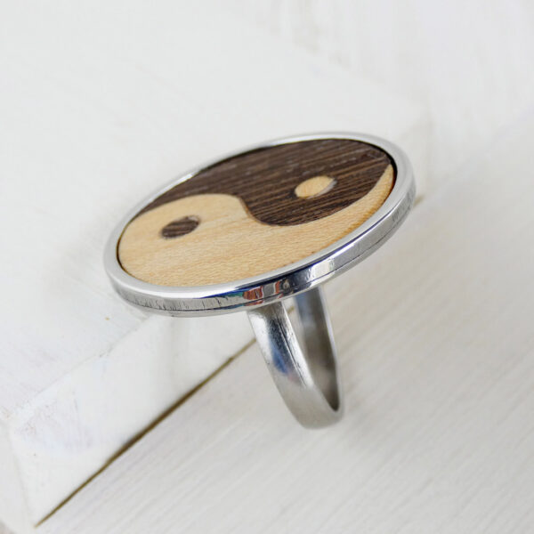 Close-up detail of the handmade yin yang marquetry in wenge and sycamore