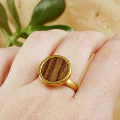Gold plated stainless steel ring with zebrano wood inlay – worn view showing texture and fit
