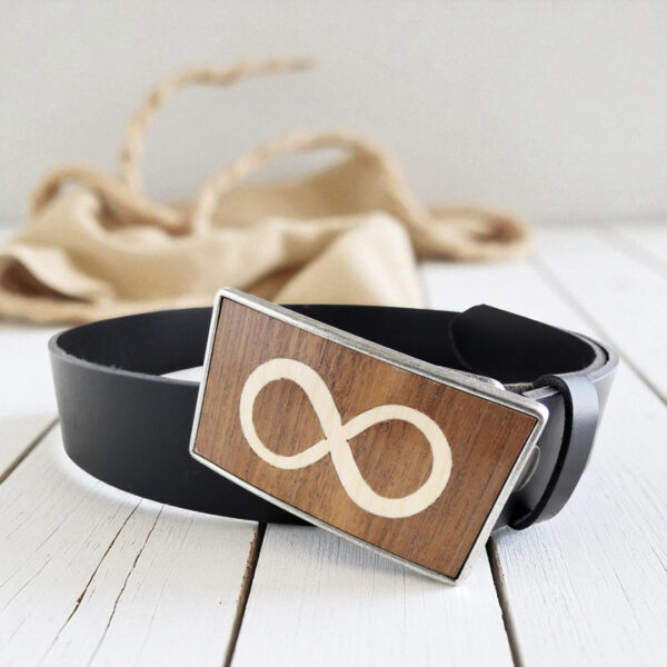 Wooden infinity belt buckle with black leather belt, styled for jeans