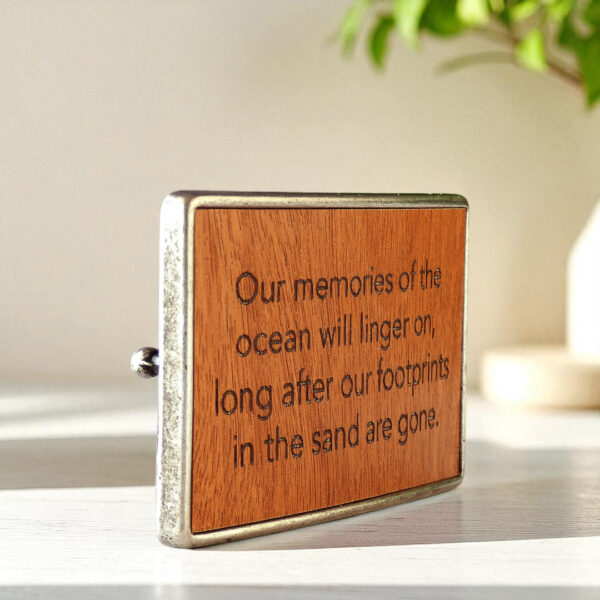 Custom wooden belt accessory with engraved lettering and metal base.