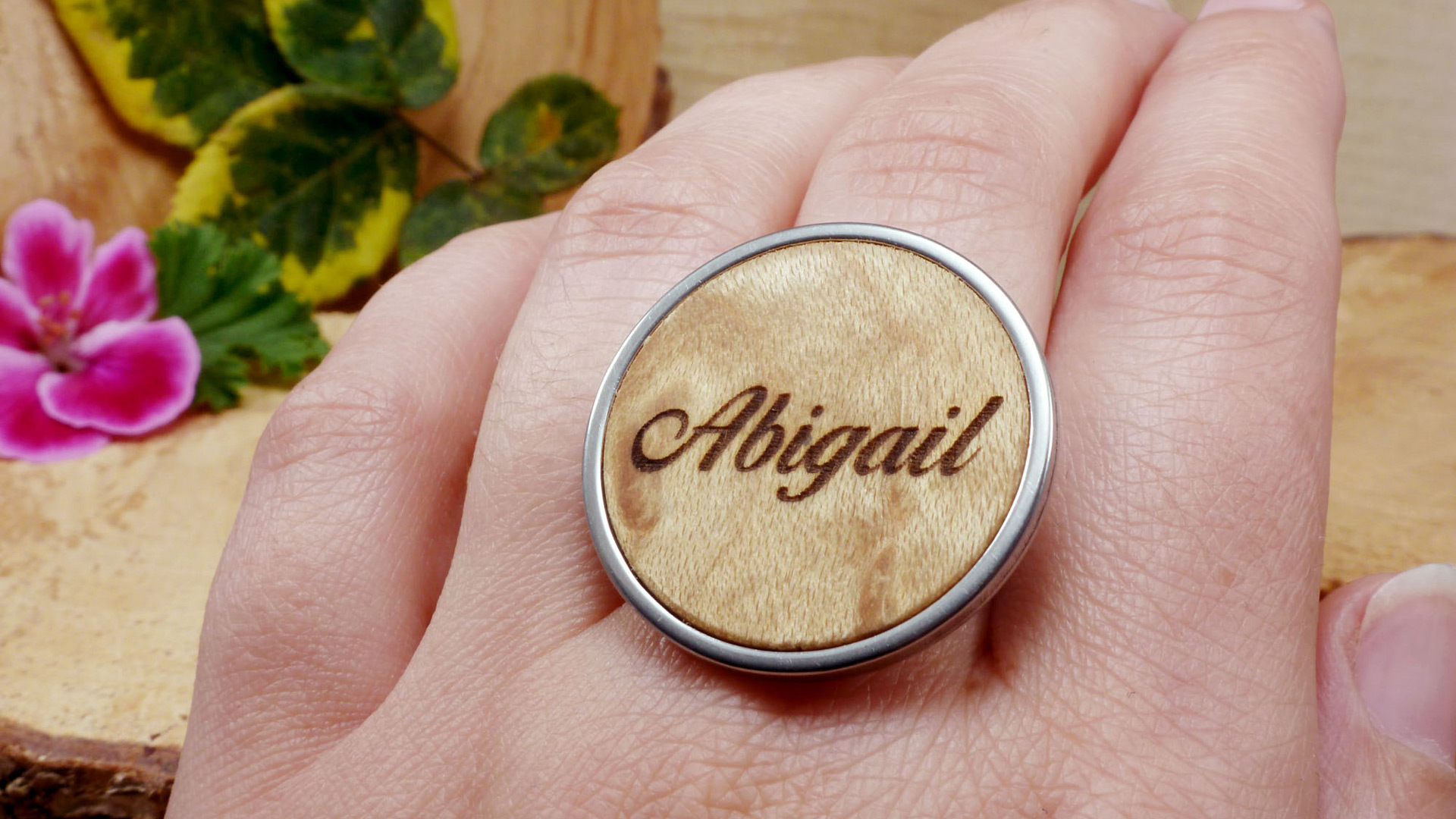 Personalized wooden and stainless steel ring engraved with the name Abigail – handmade custom jewelry for her