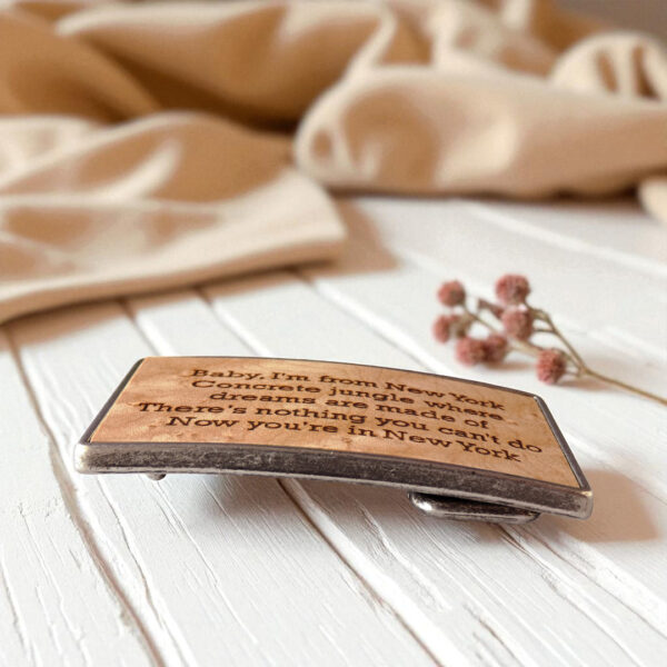 Engraved wooden gift buckle made for personal messages and meaningful occasions.