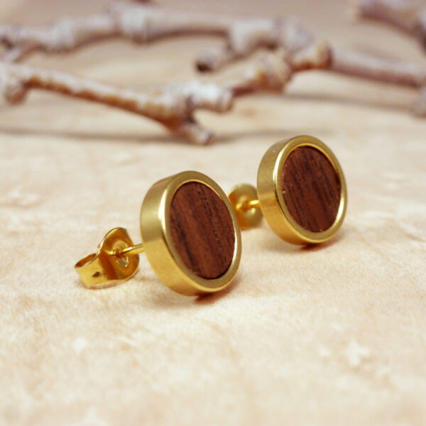 Close-up of walnut wood and gold plated stud earrings – natural handmade jewelry