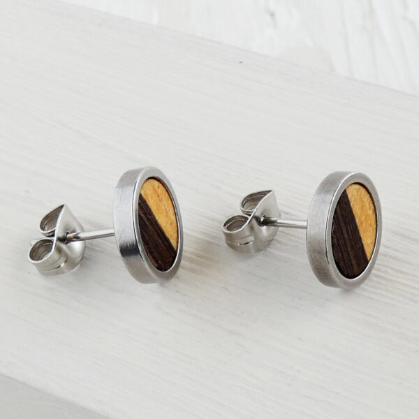 Close-up of oil-finished wood surface on handmade earrings