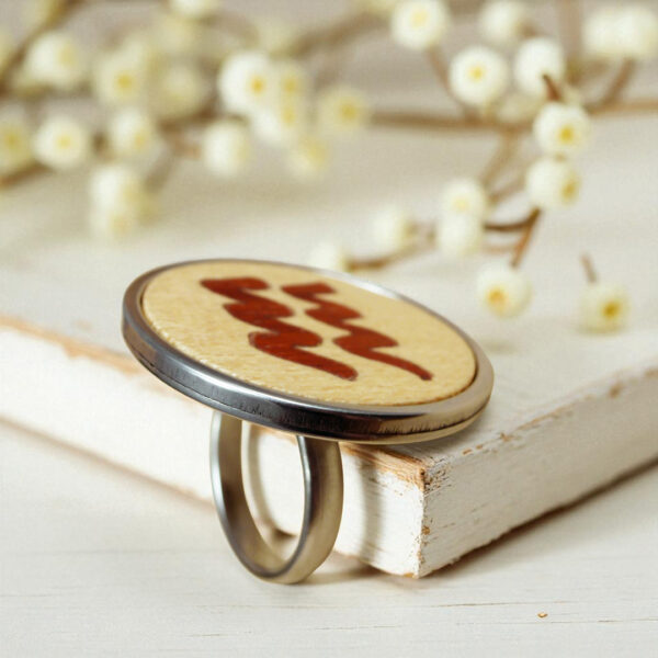 Handmade jewelry ring with Aquarius zodiac sign in wood