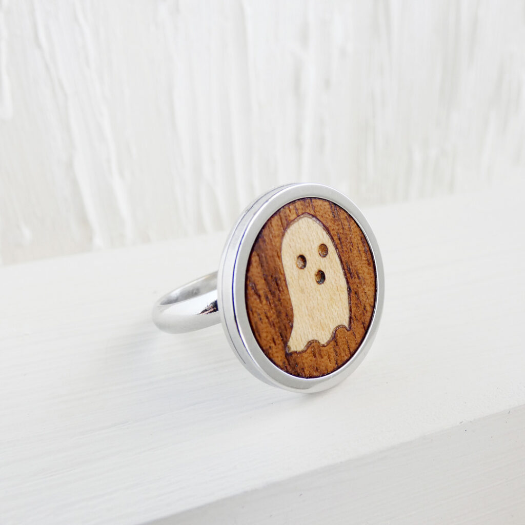 Handmade ghost ring with walnut base and stainless steel band