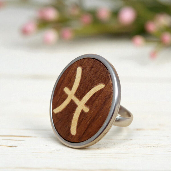 Handmade Pisces ring crafted with wooden zodiac symbol and stainless steel base