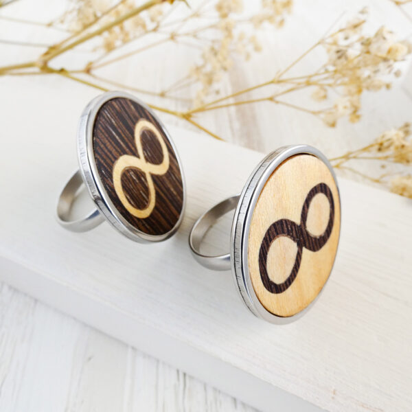 Infinity symbol rings in stainless steel with wood inlay