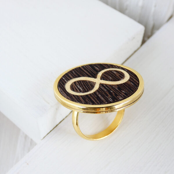 Infinity symbol ring with wenge and sycamore wood in gold-plated steel