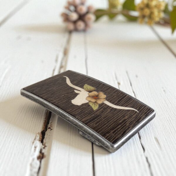 Wooden longhorn fashion accessory belt on white background