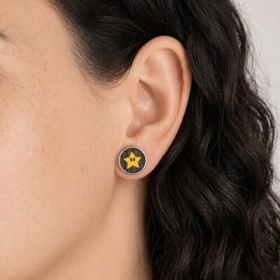Wooden Mario star earring worn in the ear