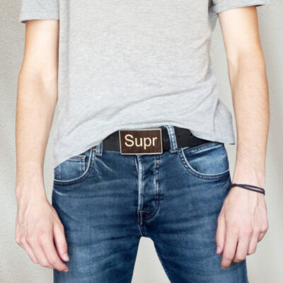 Man wearing a wooden keyboard buckle with jeans