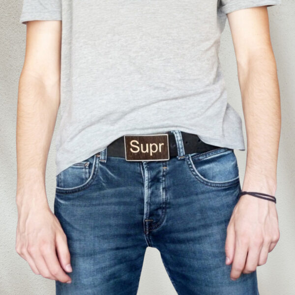 Man wearing a wooden keyboard buckle with jeans