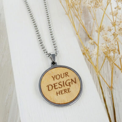 Personalized wooden necklace engraved with the words Your Design Here in a stainless steel pendant