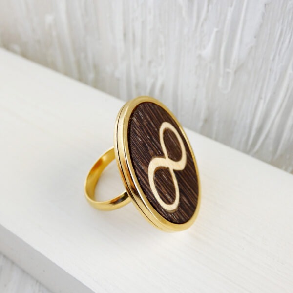 Stainless steel infinity ring with wenge and sycamore wood in gold-plated finish