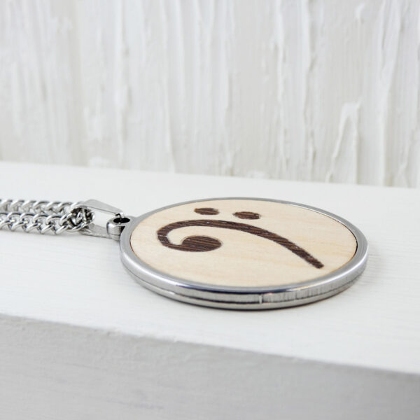 Unique music jewelry necklace with handcrafted bass clef symbol