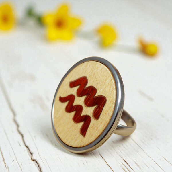 Women’s zodiac ring with Aquarius symbol in wood inlay