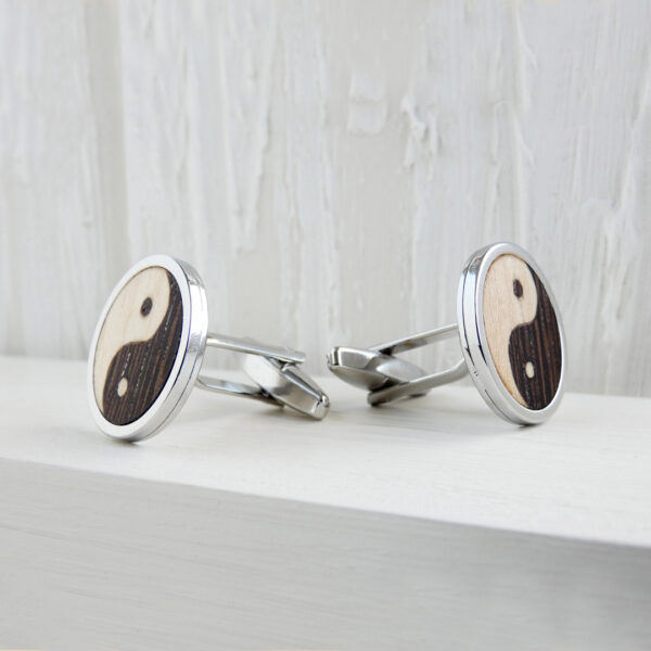 Close-up of handmade wood inlay cufflinks in wenge and sycamore
