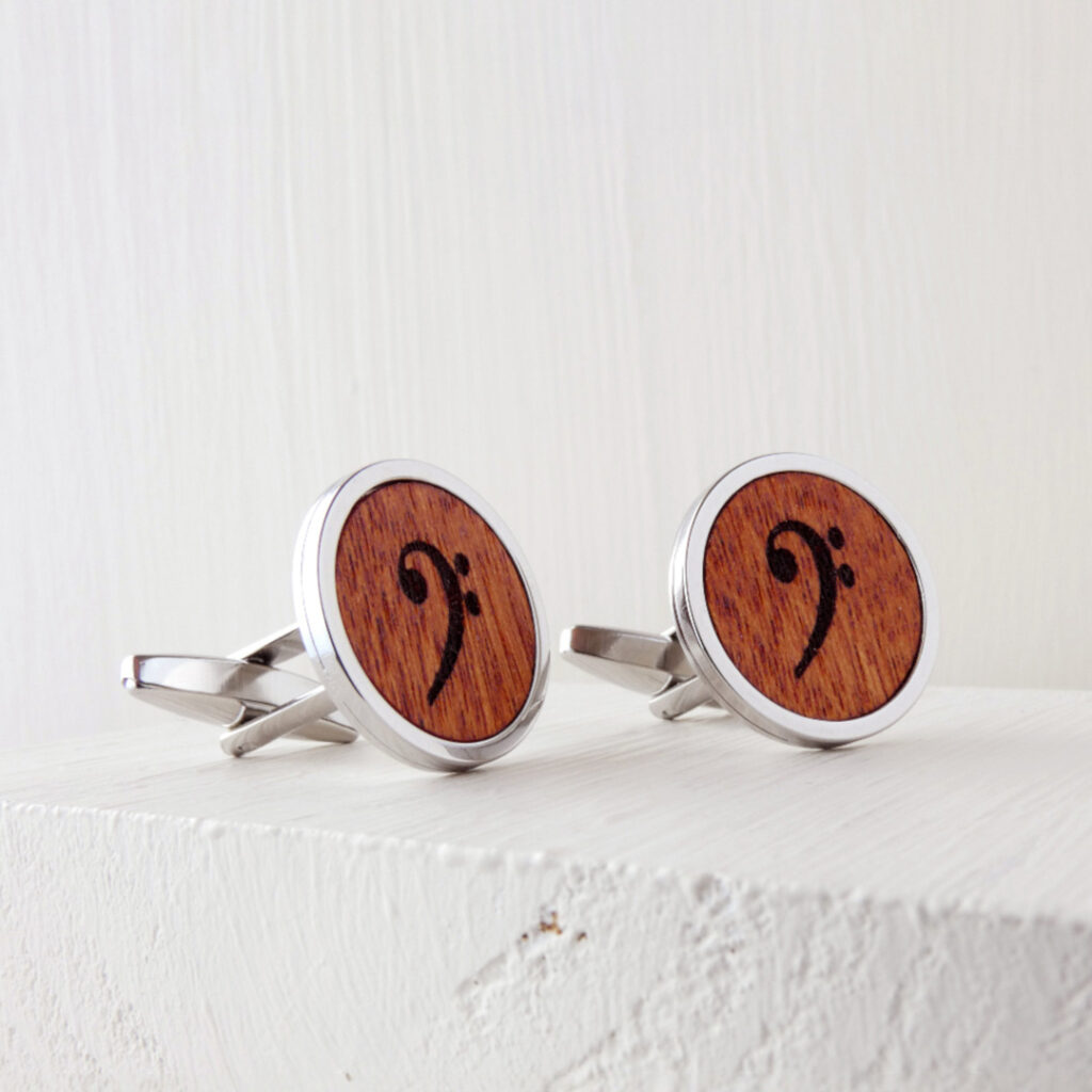 Wooden bass clef cufflinks with a refined engraved symbol set in a durable metal base