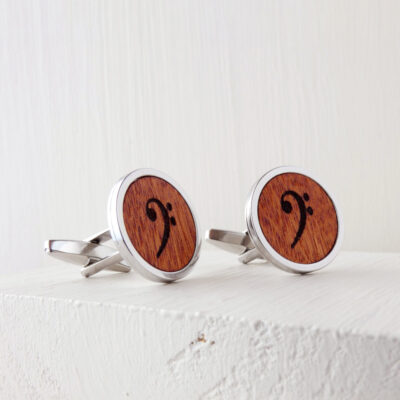 Wooden bass clef cufflinks with a refined engraved symbol set in a durable metal base
