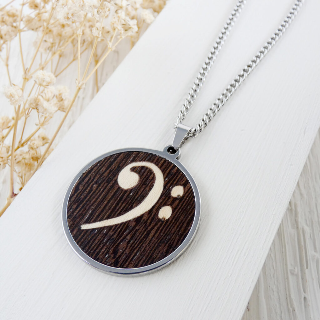 Wooden bass clef necklace with stainless steel chain and handcrafted wood inlay
