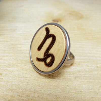 Wooden Capricorn ring handcrafted in natural wood with a stainless steel base