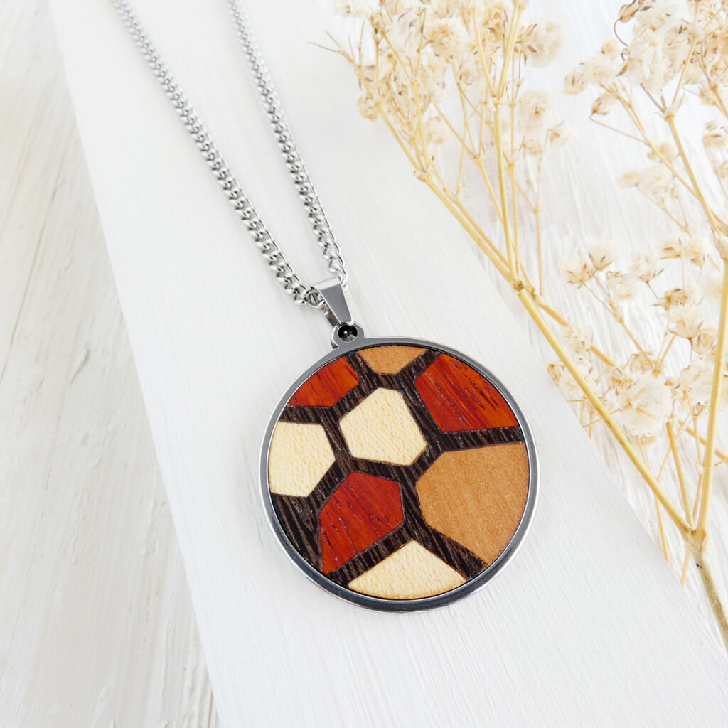 Handmade wooden geometric necklace with Trencadís design in natural wood tones