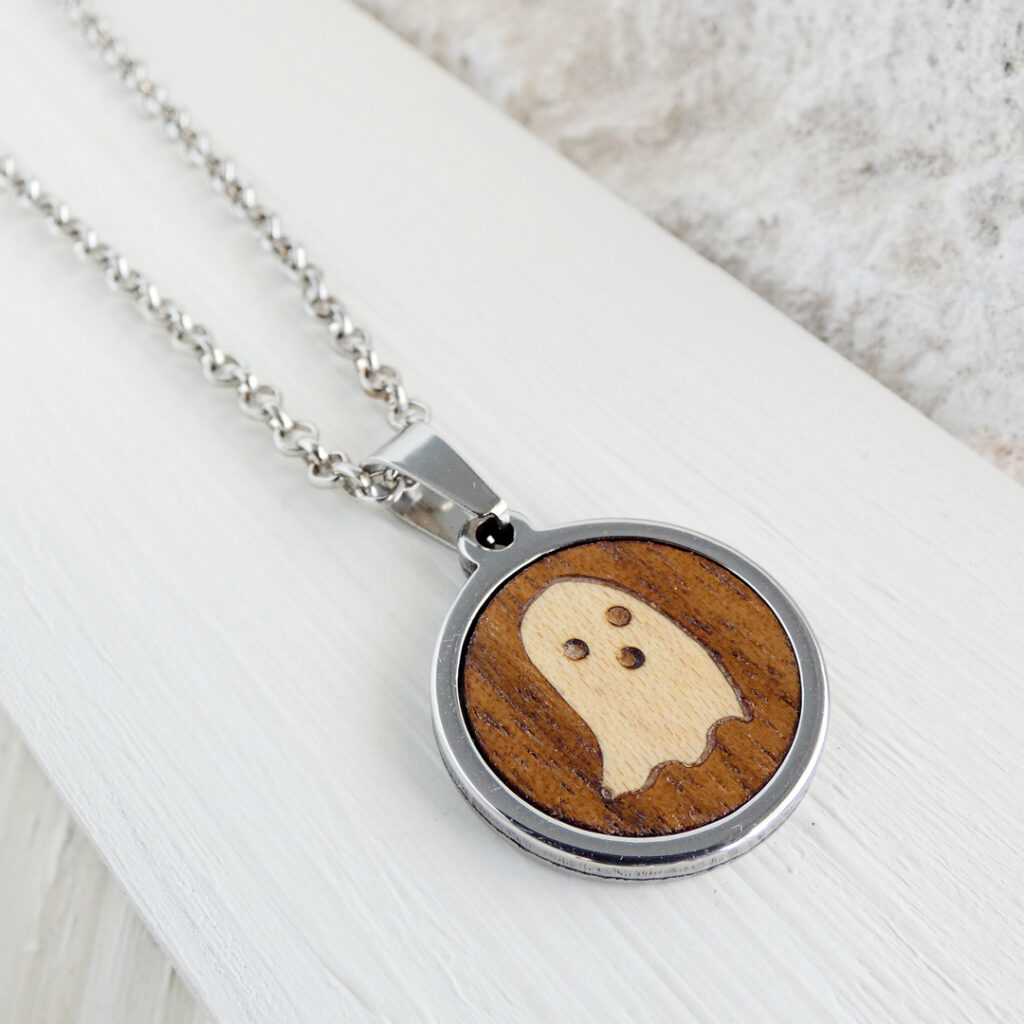 Wooden ghost pendant handcrafted in walnut and sycamore wood