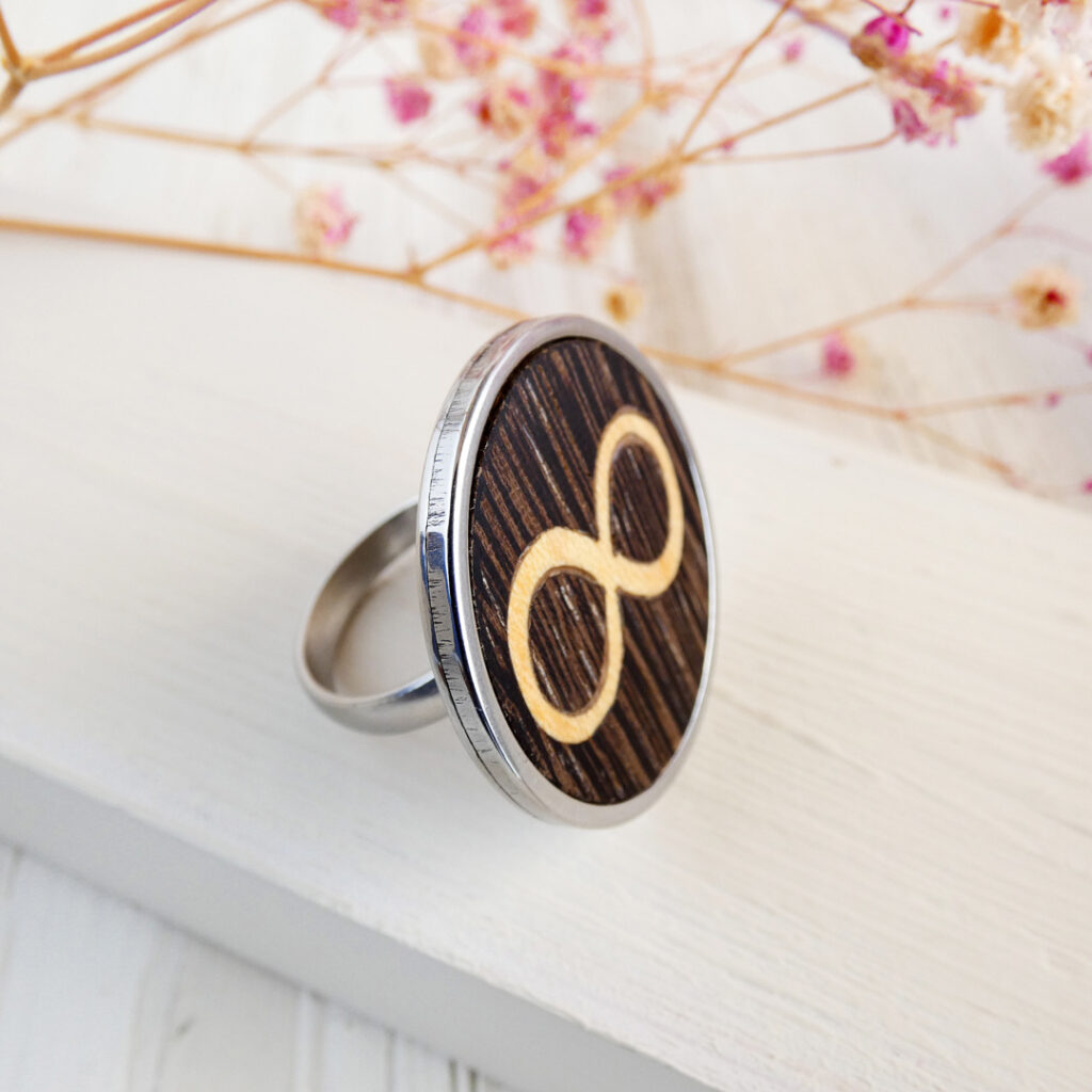 Wooden infinity ring with wenge and sycamore inlay in stainless steel finish