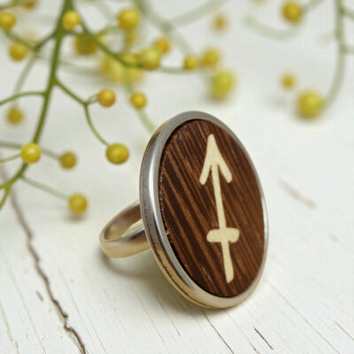 Wooden Sagittarius ring with arrow symbol in wood inlay, set in stainless steel