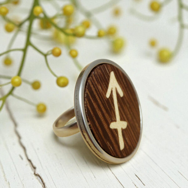 Wooden Sagittarius ring with arrow symbol in wood inlay, set in stainless steel