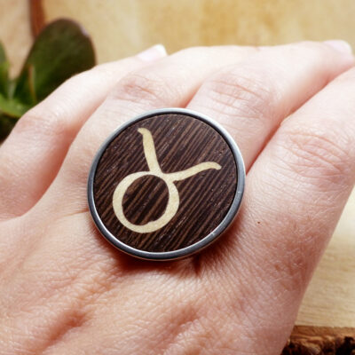 Wooden Taurus ring worn on hand, handmade and elegant